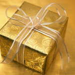 Christmas Present Wrapped in Gold and Silver